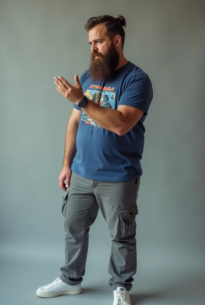  man with a brown beard wearing a blue t-shirt with a star war print with gins pants and white shoes he is sitting in profile view but his face is looking at the camera at an angle of 3/4 He also finds himself extending his right to the front with his palm...