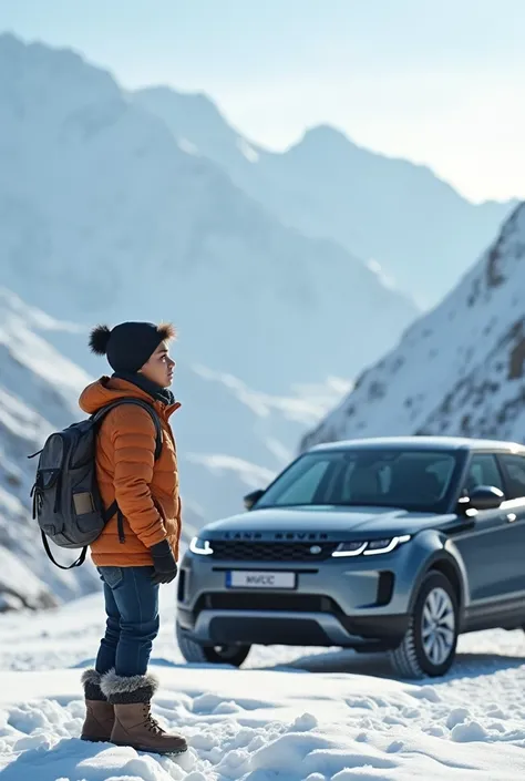 An Indian teen boy whos standing very far away in snowy mountains and landrover beside him during the day in manali