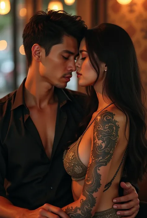 Handsome Indonesian man sitting with beautiful woman with dragon tattoo 