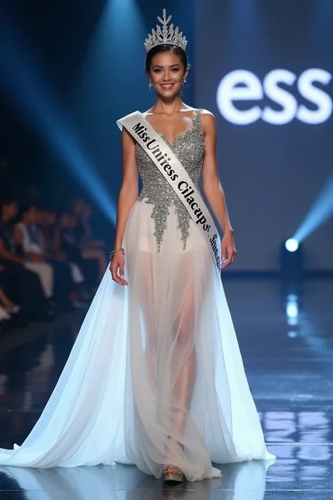 full body photo. a beautiful woman from Indonesia.smiles.becomes miss universe.her hair is neatly tied in a bun. wearing a long white dress with a combination of silver and a motif of a peacock spreading its feathers. wearing a crown. wearing high heel sho...