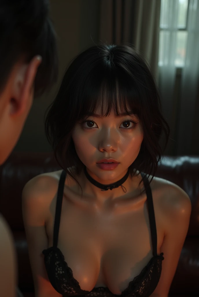 An Asian girl with short hair in a bdsm session