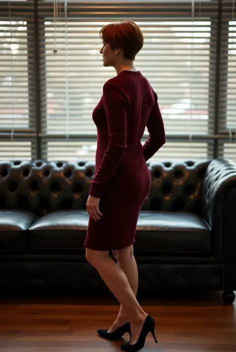 mature executive secretary auburn pixie hair burgundy sweater dress black heels LOCATION: office black leather furniture venetian blinds in windows