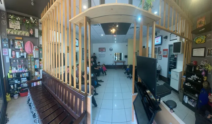 put 3 customers waiting in the bench, 1 cashier and 2 barber on middle left doing haircut, 2 hair tech on the middle right, on the further left 2 nail technician doing their job. staffs standing in middle back to back, do not edit the photo just put staffs...