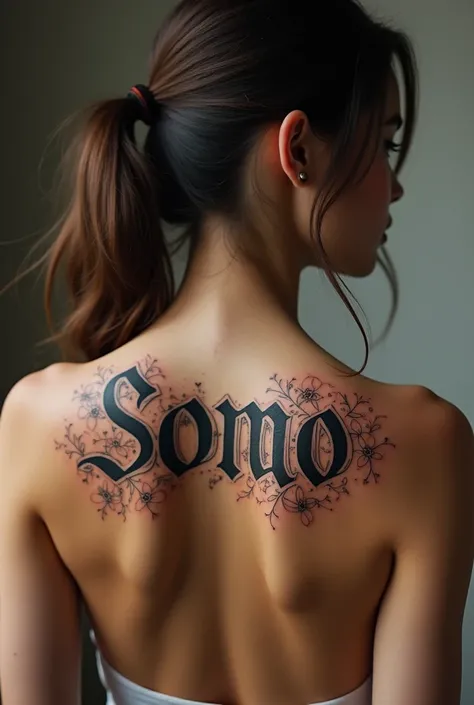 A special design of "somo" letters tattooed on a girls back 