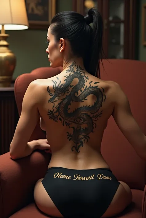  Russian mobster with her hair brushed back, shirtless and with her back tattooed with a dragon ,  sitting in an armchair , wearing black shorts with their volume marked on the front