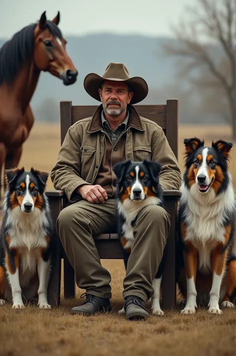 A hunter sitting on chair and 4 Australian shepherd pose around him (horse stand at his background)