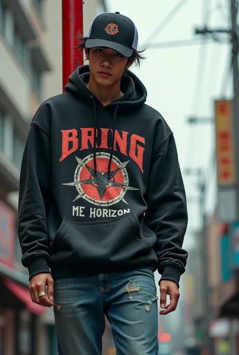 a 25 year old Japanese man wearing a black truckersnap hat, wearing a worn black hoodie with a picture of the band Bring Me the Horizon in death metal font wearing blue jeans, standing pose on a red light pole, color tones