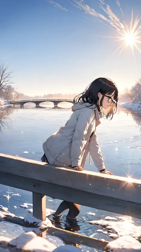 A girl with black hair and glasses looks at the sparkling river surface reflecting the morning sun from a bridge on a sunny winter morning