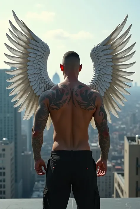 male stands topless on the roof of a penthouse. He can only be seen from behind. his arms are tattooed, and on his back, he has tattooed angel wings that stretch across his entire back