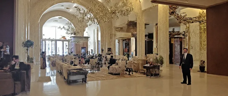 Reception with attendant,  Larger and more sophisticated space .  Classic and modern elements combine with royal style.