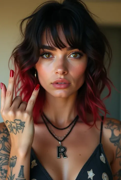 Attractive female model with light brown eyes and black hair with red highlights wearing a R necklace with tattoos glossy lips and natural makeup wearing a haters shirt flipping the bird with her finger in a beautiful background 