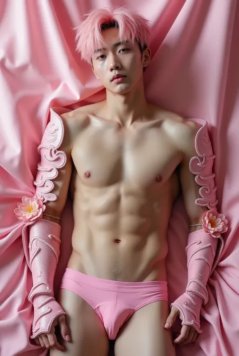 Handsome Korean man, 19 years old, light pink hair, undressing to show six-pack, wearing pink iron armor on both arms, wearing only a pink G-string, the background is pink cloth (realistic image)