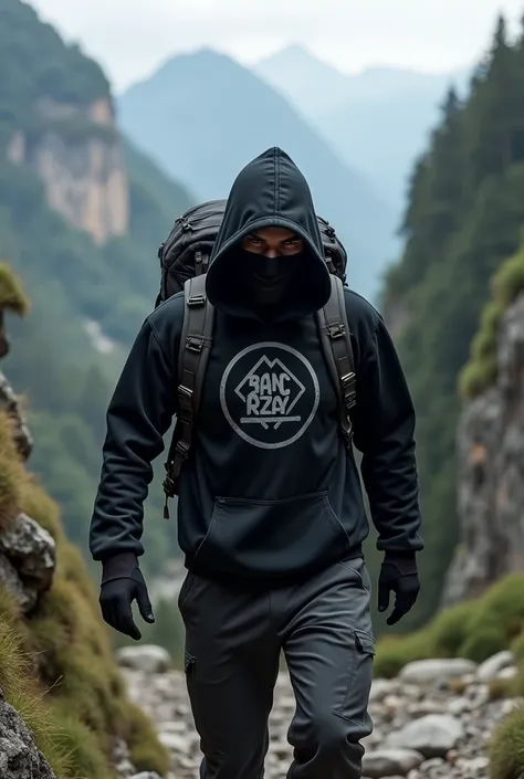 A male wearing a black Hoodie sweater and mask is descending a mountain while carrying a mountain bag , THERE IS A BANG AZAY NAME LOGO on a black Hoodie sweater  