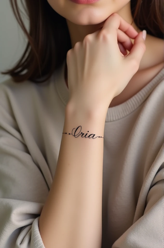 Minimalist bracelet tattoo with the name Iria 