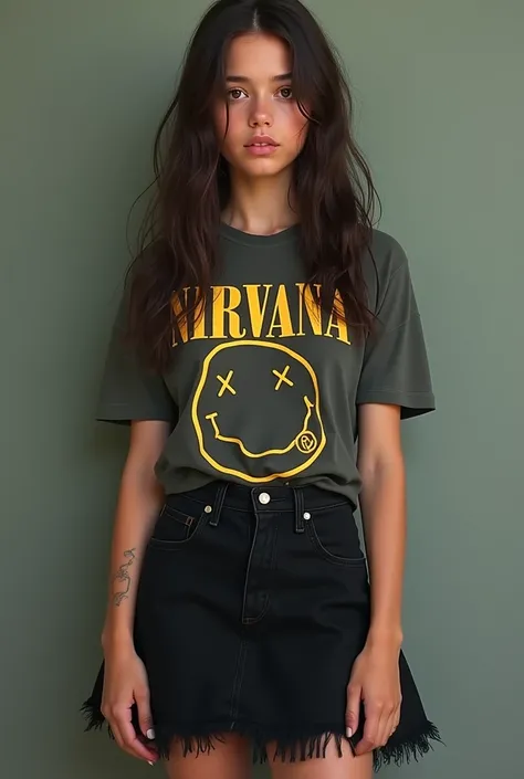 A 19-year-old U.S.-born girl with dark brown hair and dark brown eyes wearing a nirvana t-shirt and black skirt