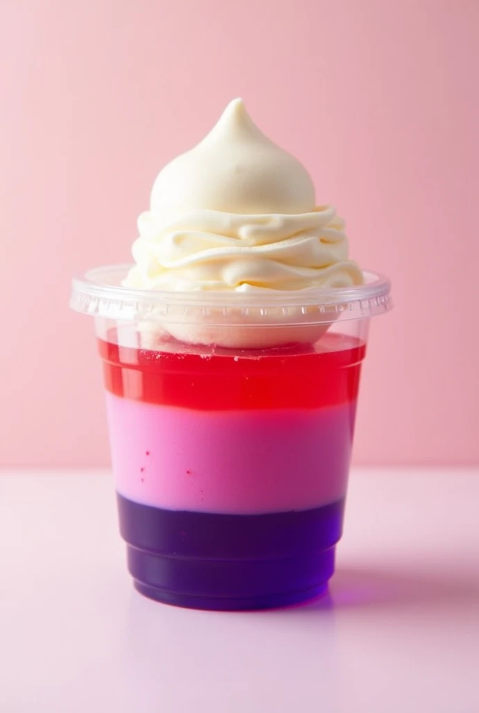 Plastic cup inside containing only gelatin of two colors (red above and purple below) with a scoop of vanilla ice cream 