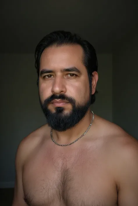  A man between 25 and 30 years old ,  of an athletic and toned build ,  with a defined physique and light chest hair .  He has short, dark hair ,  with a light and well-groomed beard .  He wears a simple silver chain necklace that adds a touch of minimalis...