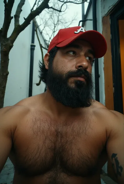 A view from below,  with the camera positioned at floor level ,  three meters away from a 38-year-old man .  His complexion is slim but athletic ,  with muscles naturally toned and defined .  He wears a perfectly outlined beard ,  with a moderate thickness...