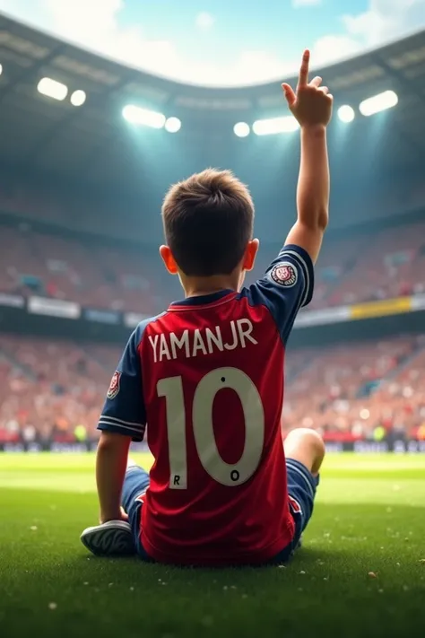 a boy sitting down lifting his right hand  after scoring a goal in football stadium  with Name written as yamanjr 10 in back from the back side