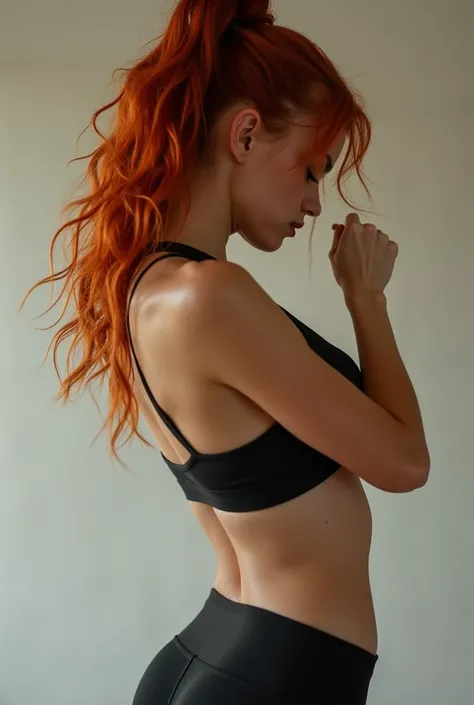 A sexy ginger haired girl in side doing excesise with only a bra on