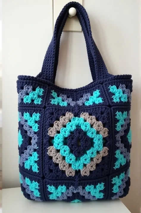 Please create a granny square crochet bag with pattern of 3 colors, mavy blue, grey and black
