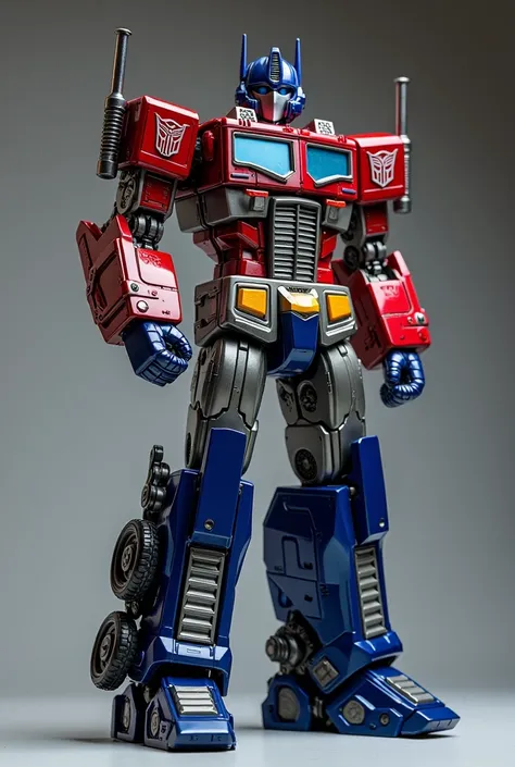 Optimus Prime:
"A small toy-like figure of Optimus Prime, featuring his iconic red and blue robotic design with realistic, detailed face details. The figure is posed standing tall with one arm raised as if giving a command, with a glossy metallic-like fini...