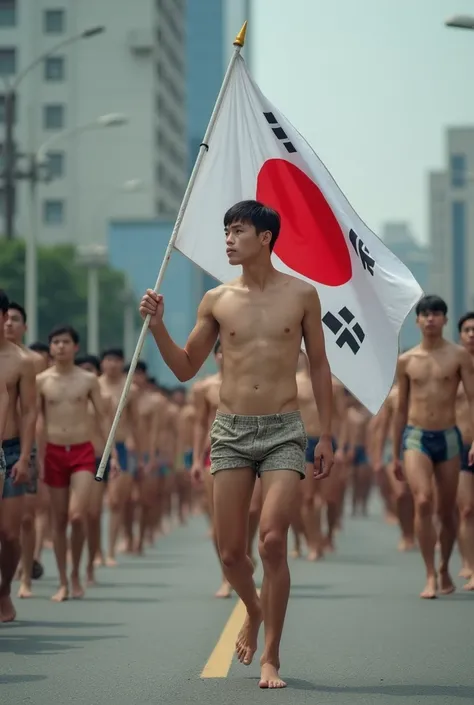 To tell him the school soldier in Japan on the streets all the parents of a military family march on the streets but only the Korean male student who grabs the flag for me who is completely naked marching grabs the flag with both hands naked and barefoot t...