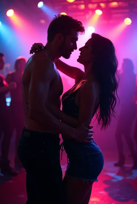 Two people dancing in a club in the dark illuminated by the colored lights of the place. Keep your face in front of the camera