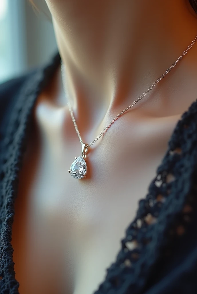 a dazzling necklace ,  a delicate piece with a droplet-shaped diamond pendant.