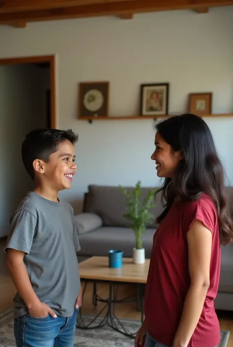 Photo of a ten-year-old Venezuelan boy wearing denim shorts and gray t-shirt talking very cheerfully with his young Venezuelan mother who listens attentively to him in the living room of his simple house