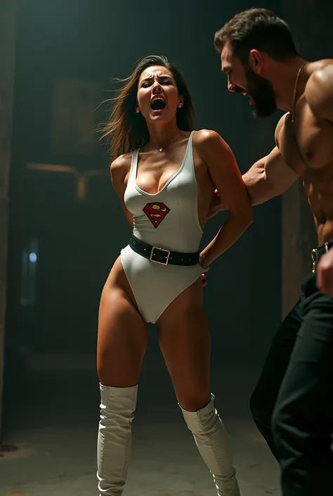 Ultra realistic cinematic photo. View of an hot brunette in sexy low-cut white latex bodysuit with black belt with red sign " B " and white high boots who getting defeated. Her arms behind her back. She screaming in pain. A black leather man hand who hitti...