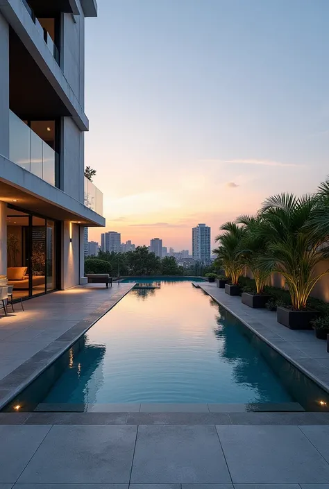  A modern infinity pool located at the back of a contemporary development , located on the ground floor .  The elegant design highlights modern in shades of gray and blue ,  with water flowing smoothly over the edge ,  creating a visual effect that merges ...