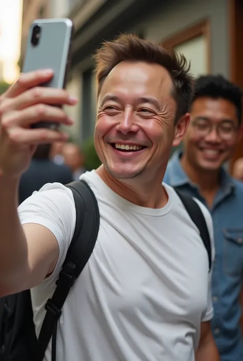 Elon musk smiling and making a selfie in a t shirt