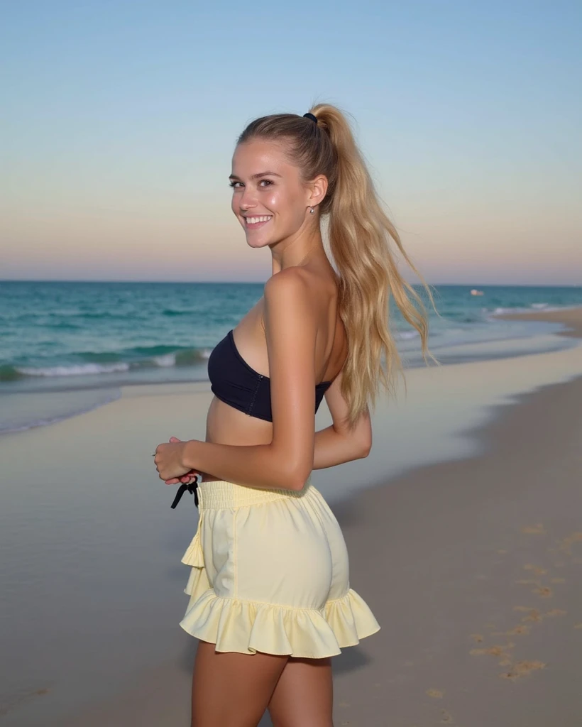 A very realistic 4k photo with lots of detail shows a young blonde, skinny, tanned and sexy woman standing on the side, on a beach. She is looking straight into the camera and laughing. She’s wearing a dark black strapless swimsuit top and a yellow ruffled...