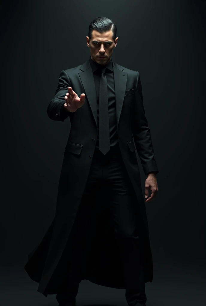 A man in black, black suit, making a gesture as if you were controlling a mind.  black background