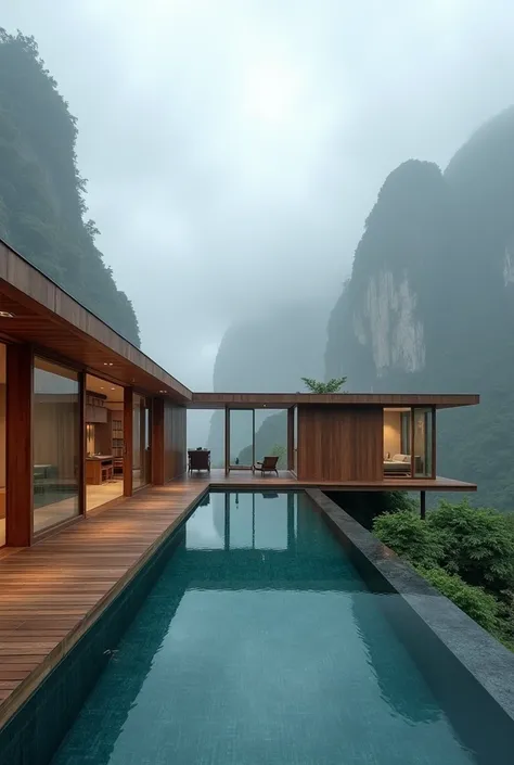 Modern style wooden house, L-shaped house, swimming pool in the middle of the house. With an open Thai kitchen Tall mirrors around the house View of high cliffs and thick fog