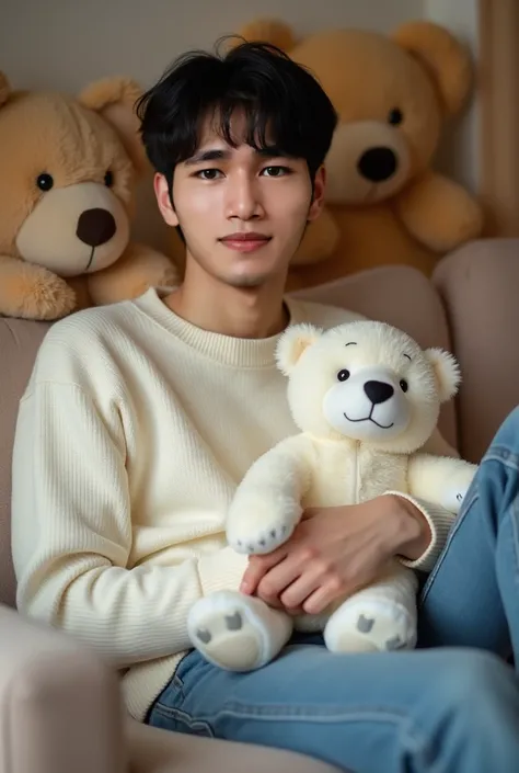  A handsome man, wearing a white sweater and jeans, is sitting on the sofa holding a polar bear doll in his hand. He has short black hair and delicate facial features with an angelic face shape and fair skin. The photo is set in a warm-colored bedroom back...