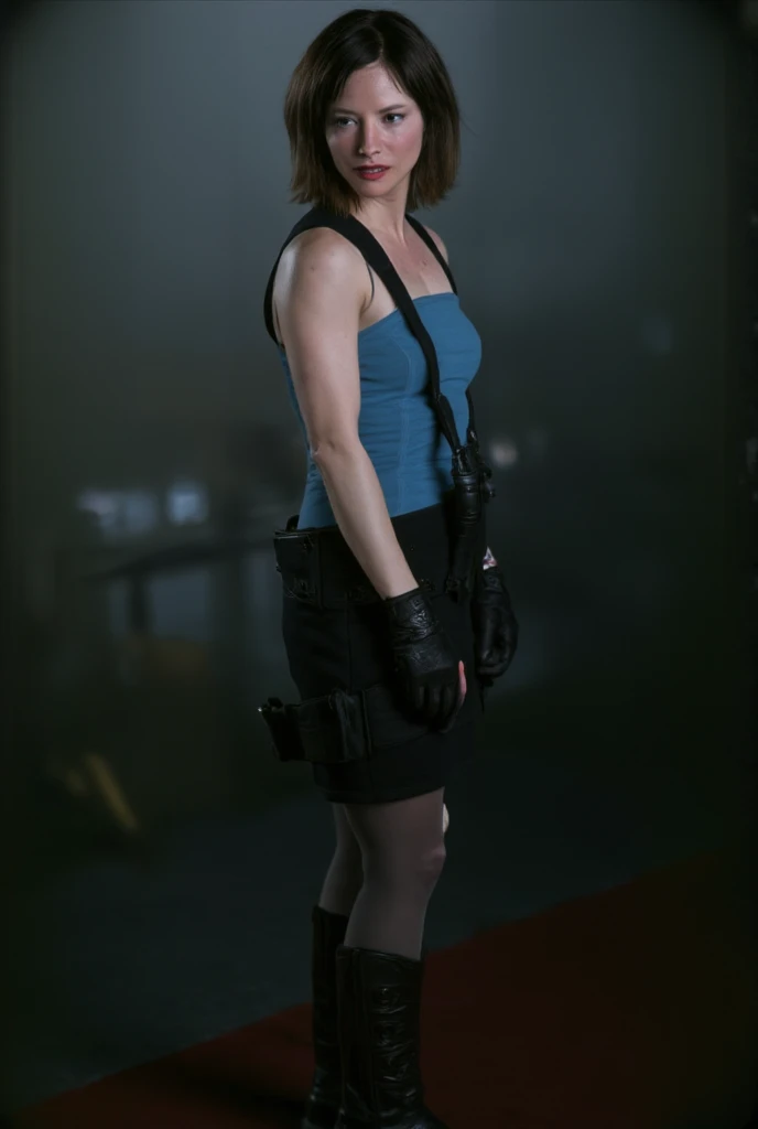 Sienna Guillory as Jill Vlentine from movie Resident Evil Apocalypse, "view portrait". She is facing sideways. The background of the image is dark, with fog. blue top, black hair, short skirt.