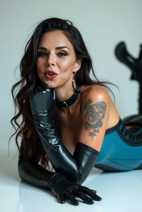 latin girl. king,  wears high boots above the knees in black leather , a tight cyan blue latex corset .  She has a tattoo on her arm and long black leather gloves above the elbow. She is lying on a white floor .  The girl has her eyes closed and her mouth ...