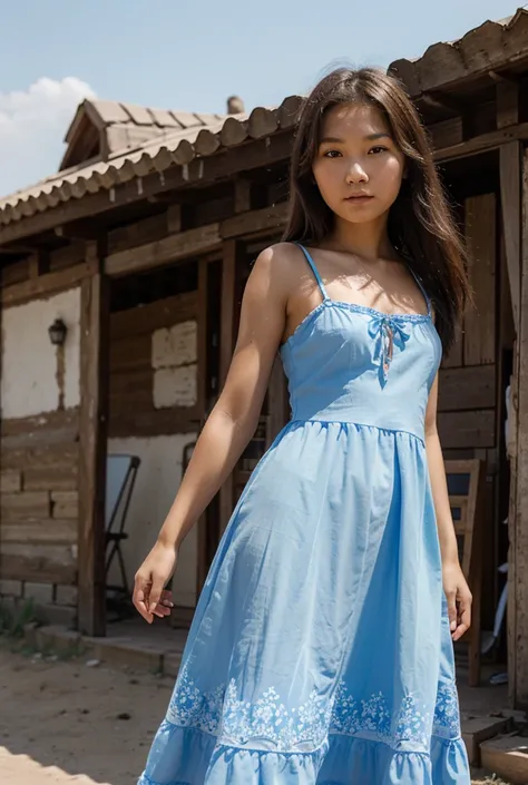 A portrait of the young girl from Kalmykia in a long summer blue dress