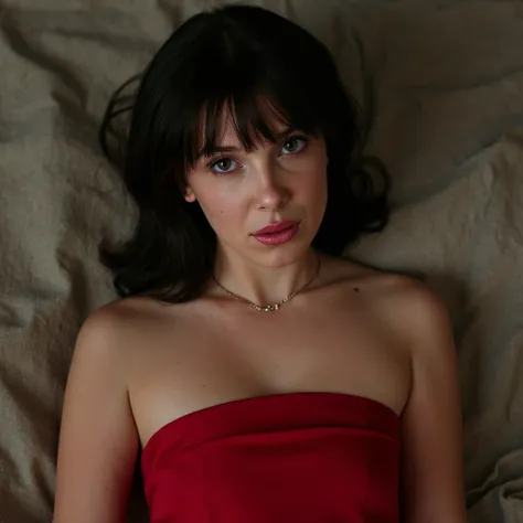 Millie bobby brown, picture from above, lying  limp on a bed on back, red strapless dress , drunk face, black bob cut haircut