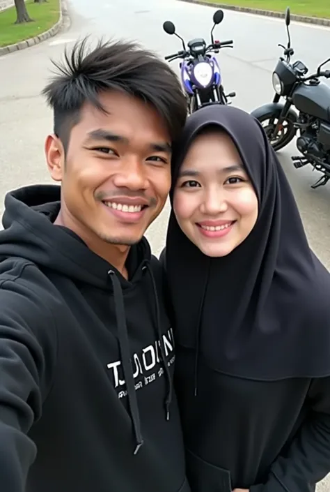 selfie photo of 2 people ,
 on the left of guy wearing black hoodie , sebelah kiri cewe memakai hoodie hitam dan berjilbab , Membawa papan tulis dgn nama  pasutri serpong ,  with motorcycle background 