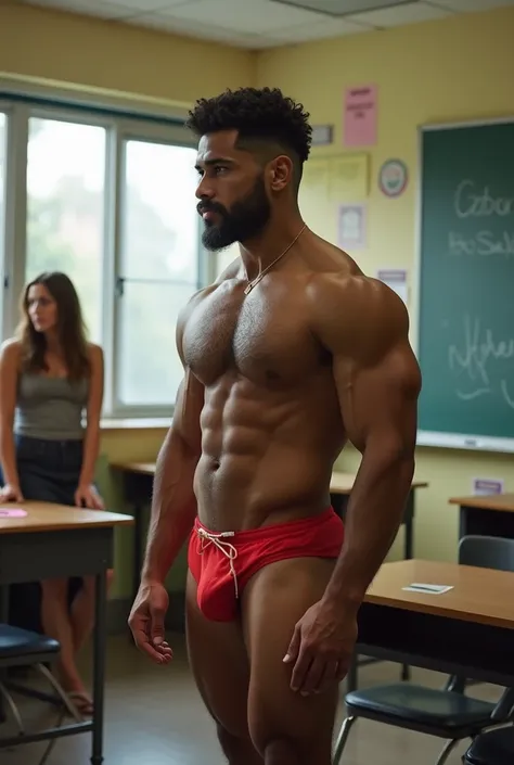 Strong young Puerto Rican teenager boy , stocky, big, bearded and hairy, Handsome, Just wearing a red thong and flip flops in the classroom next to a beautiful female bodybuilder doing Arnold bodybuilding pose for the students who watch him attentively.