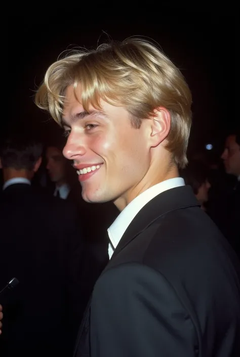 90s side profile photo taken from afar at night of a candid moment where a 24 year old italian angelical beauty boy with short wew blond hair and good jawline is in an event. hes wearing a formal wear and belt and appears unaware of the photo being taken. ...