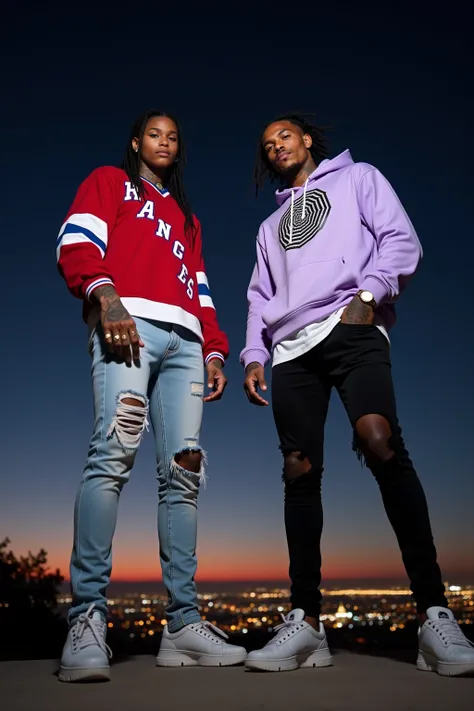 A low close angle of 2 very tall, very fit, and slender 67" male instagram influencer models standing tall over the camera at the griffith observatory at night overlooking los angeles at night. One male is a light brown skin african american male and the o...