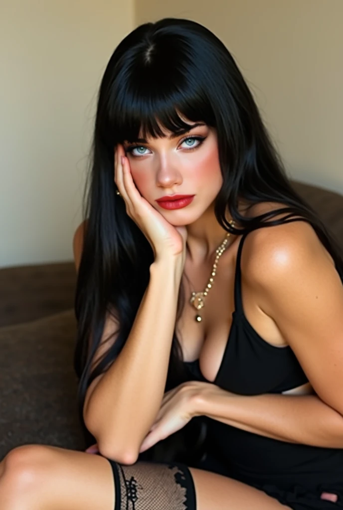  The image shows a woman reclining in a relaxed position .  has long ,  smooth and black with straight bangs partially her forehead .  Her skin is fair and has light eyes ,  probably green or blue ,  with defined makeup that includes dark eyeliner on the e...