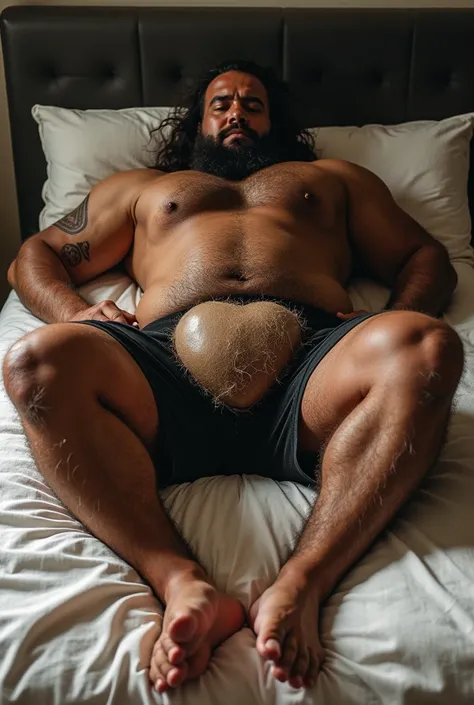 Maori man bear , Hes lying on a mattress , It&#39;s hairy, that show his legs and feet,  is fat muscular , his penis is big, her hairy testicles, by the ruby 