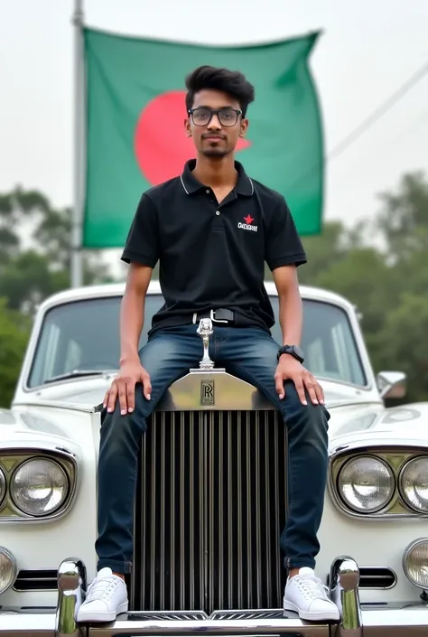 A young man sits on top of a white Rolls Royale. The young man is wearing a black shirt with "OMI" written on the front. He has glasses and white shoes on his feet. A Bangladeshi flag flies behind him. The background of the photo