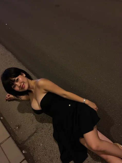 top down image beautiful detailed photograph,  short black hair cascading over her shoulders,  wearing a black strapless dress cleavage, laying down in the street at night, looking at the viewer, smile solo. wearing heels. high quality camera. clear image....