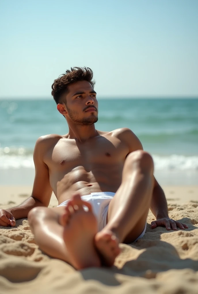 An 18-year-old Latino boy , attractive-looking ,  he is lying on the sand of a beach under a clear sky .  He wears only a tight boxer that highlights his athletic figure .  He is reclining with his legs extended towards the camera ,  showing the soles of h...